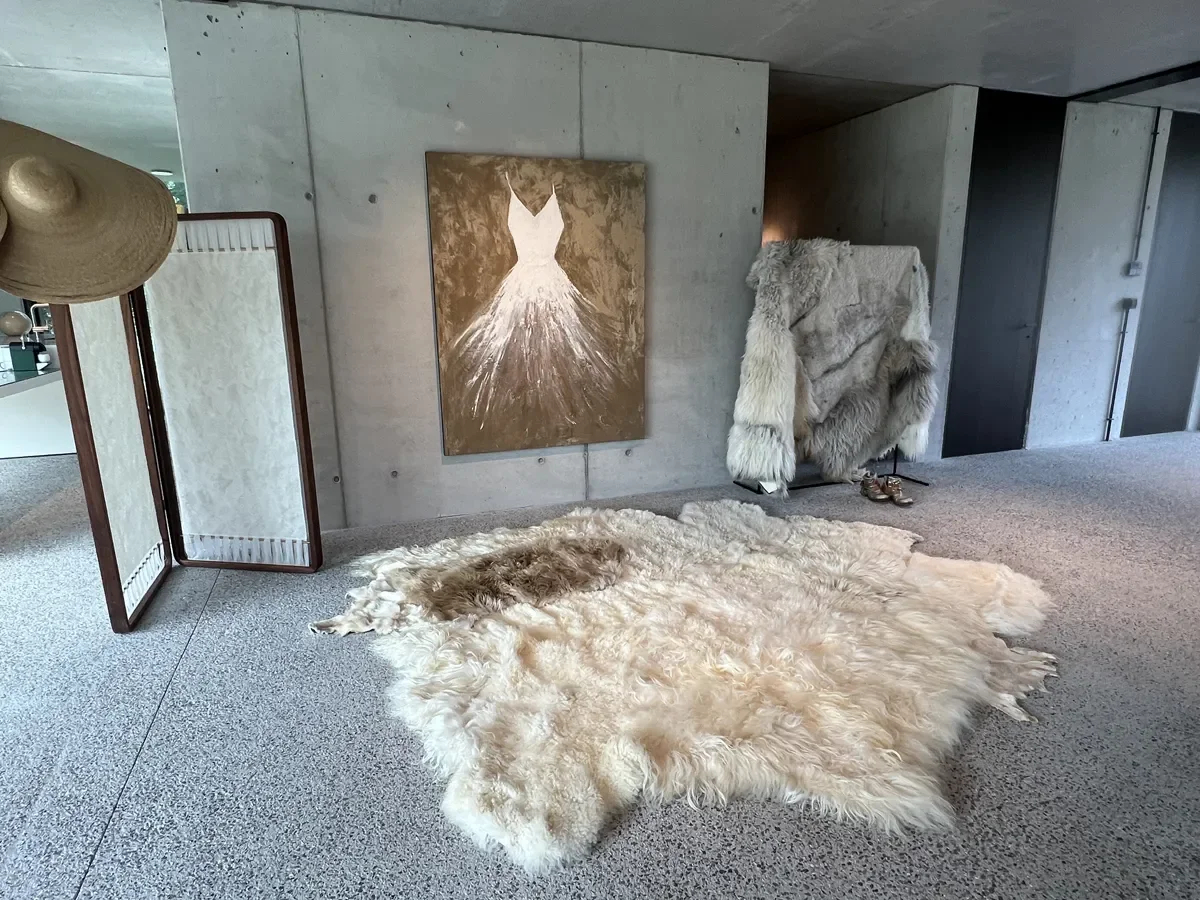 Prulleke by Wol Society, a large creamy ivory sheep skin rug with an oval taupe-brown pelt