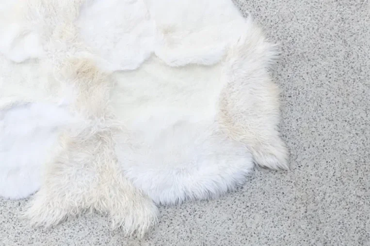 Lulu by Wol Society, a white and ivory sheep skin rug with smooth and fluffy pelts