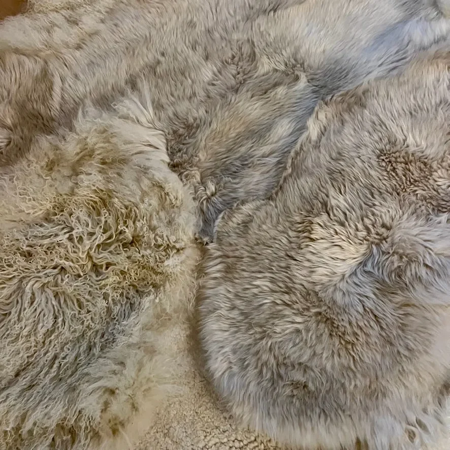 Punda by Wol Society, a dove grey and ivory sheep skin rug with soft, fluffy fleece