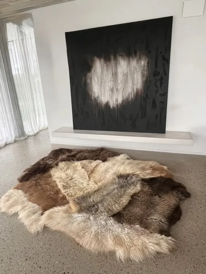 Balou by Wol Society, a patchwork sheep skin rug in honey, soft grey and chocolate brown