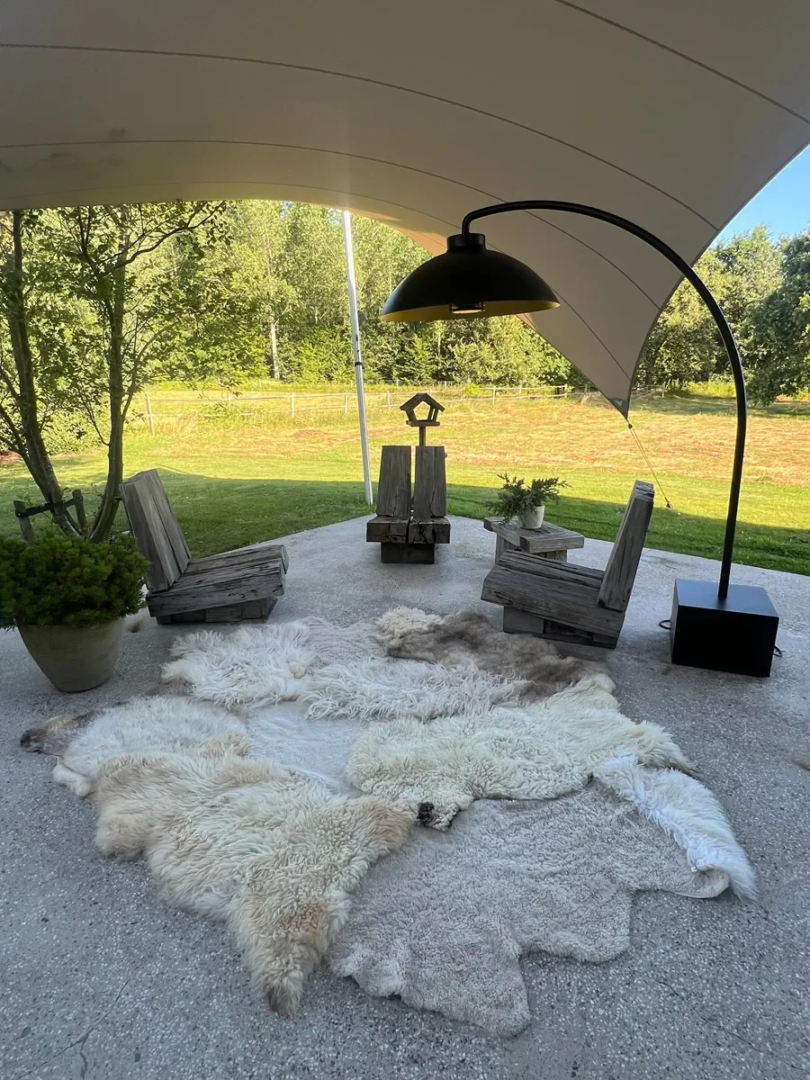 Tilly Moon by Wol Society, an ivory sheep skin rug with taupe pelts, silver grey curls and small brown spots
