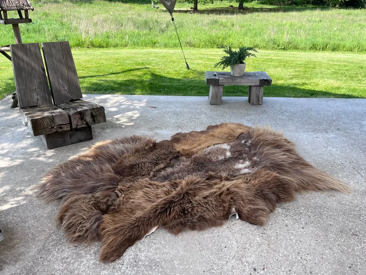 Baa-rista by Wol Society, a shaggy coffee-brown sheep skin rug with toffee tips and cream flecks.