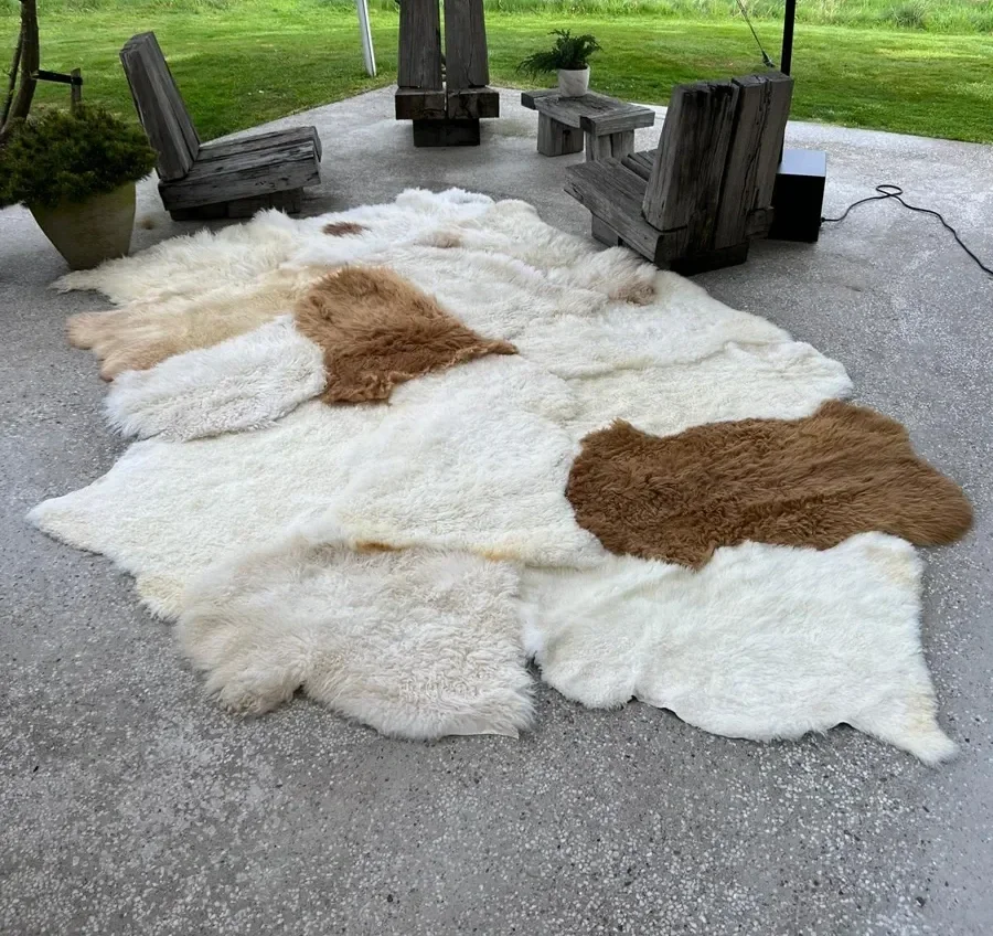 Coqui by Wol Society, a huge white sheepskin rug with two caramel pelts