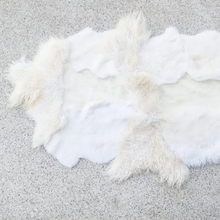 Lulu by Wol Society, a white and ivory sheep skin rug with smooth and fluffy pelts