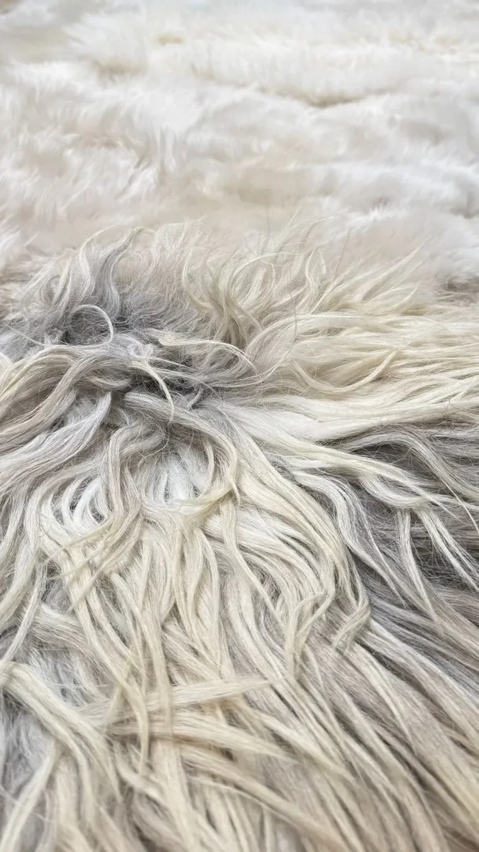 Ella by Wol Society, an ivory sheep skin rug with long grey-tipped locks over dense curls