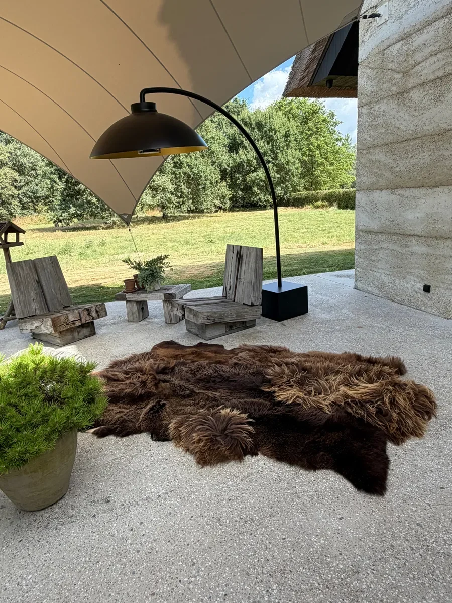 Zoomie by Wol Society, a shaggy chocolate brown sheepskin rug with honey-colored tips