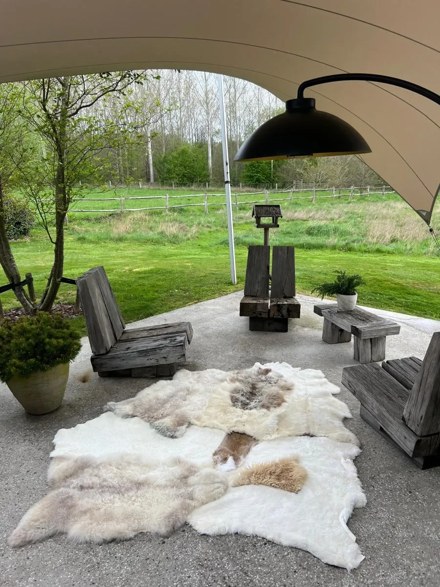 Twinkle by Wol Society, a white sheepskin rug with smooth panels and fluffy cream and taupe pelts