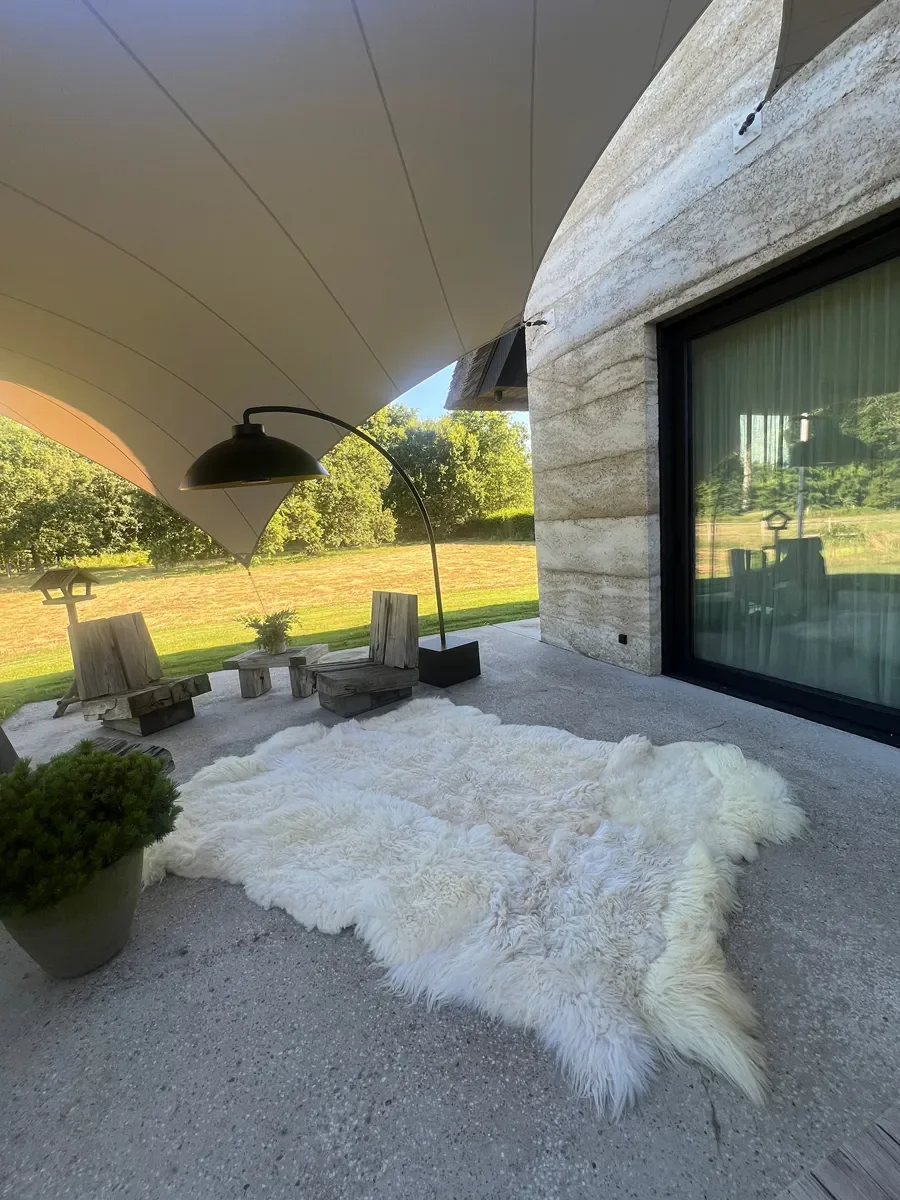 Winnie by Wol Society, a large creamy white sheepskin rug with long, airy fleece