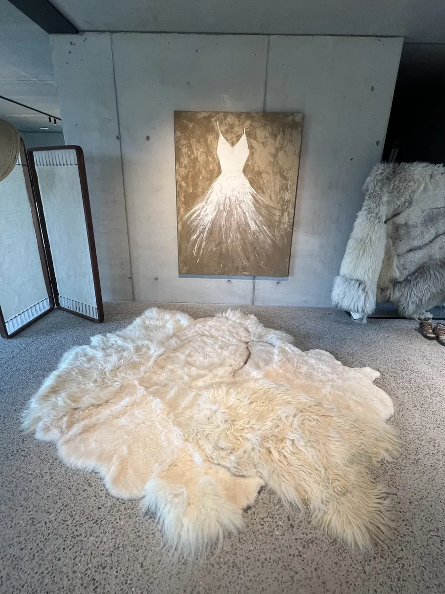 PomPom by Wol Society, a buttery cream sheep skin rug with long, fluffy edges