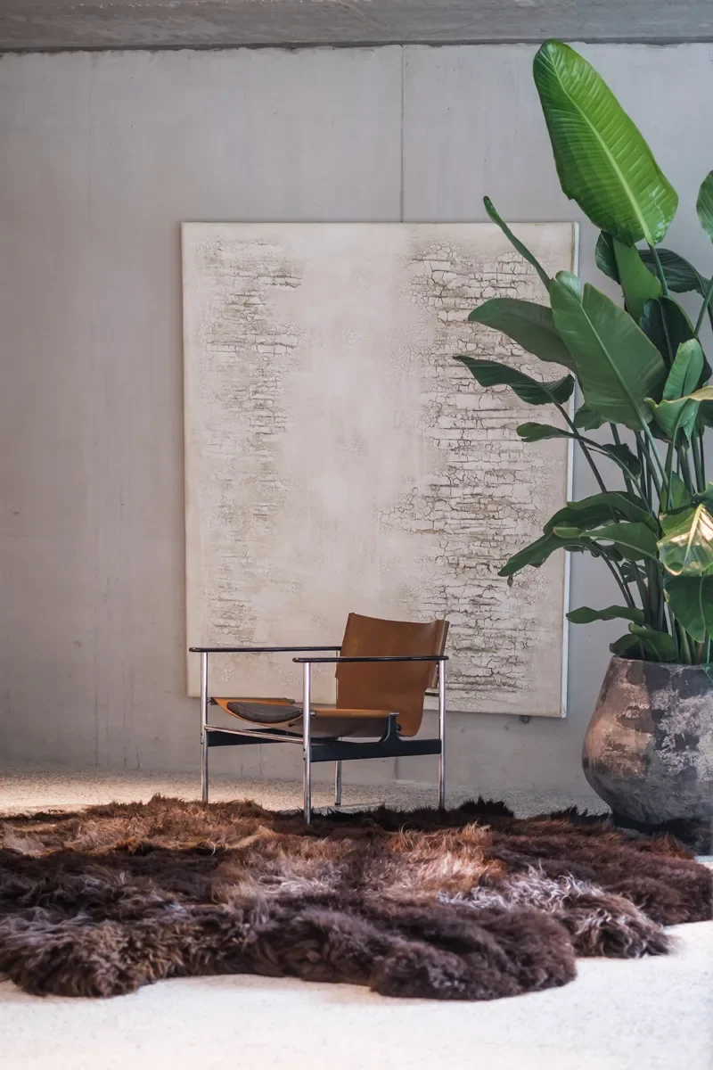 Bruno by Wol Society, a giant dark brown sheepskin rug with smoky grey-brown, frost-tipped pelts