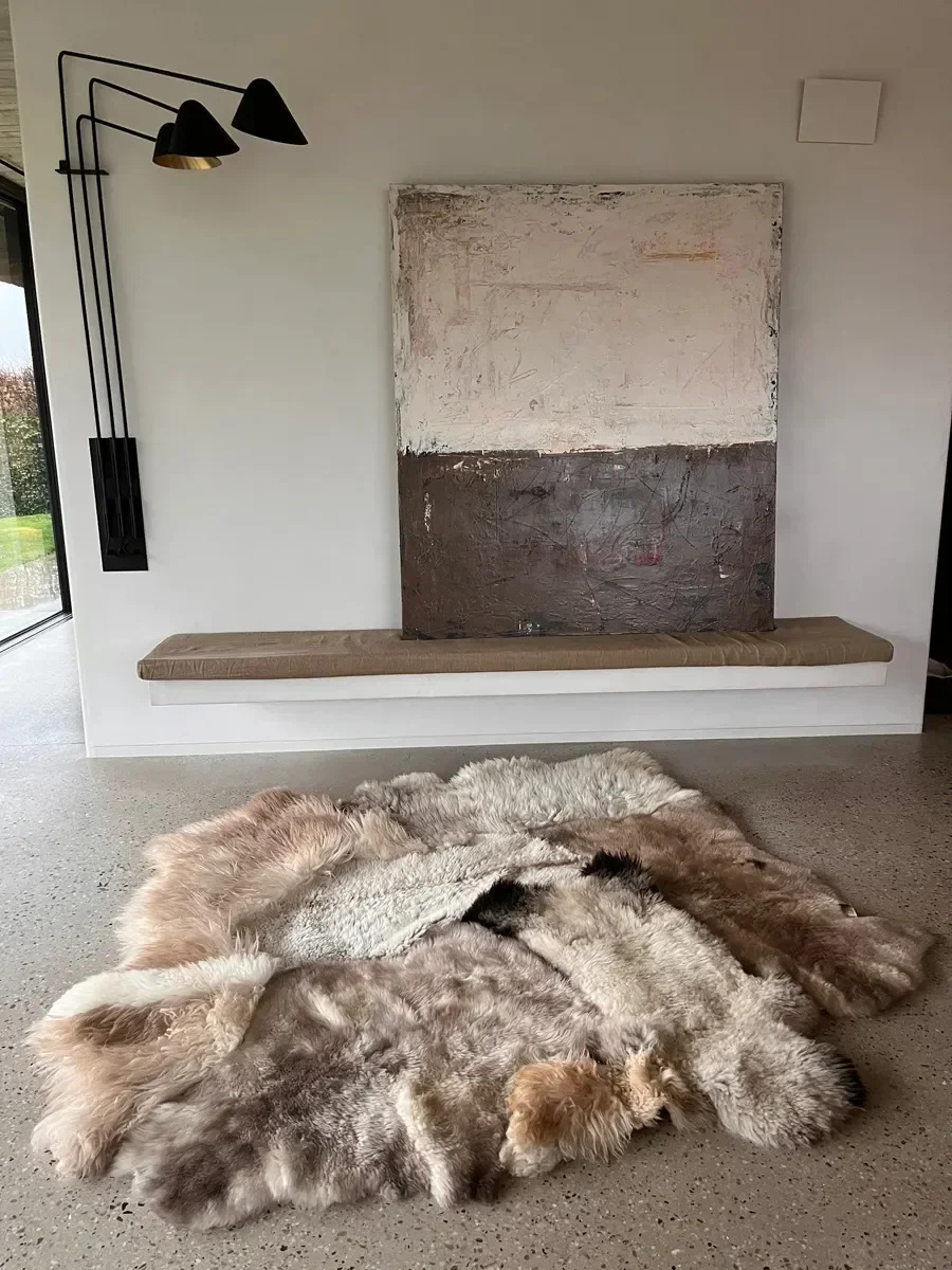 Fragile by Wol Society, a patchwork sheepskin rug in silver grey, warm taupe and ivory with charcoal accents