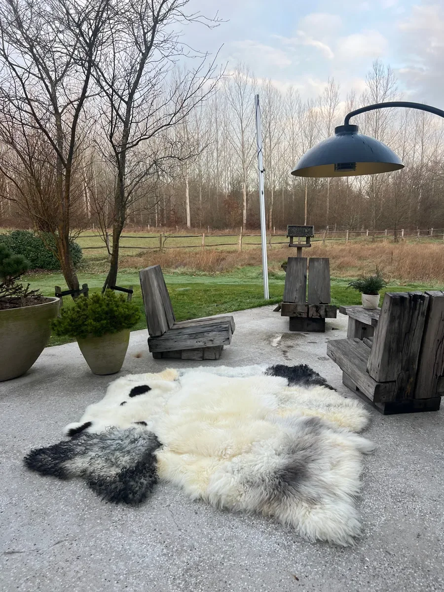 Timmy by Wol Society, a cream sheep skin rug with charcoal and soft grey pelts