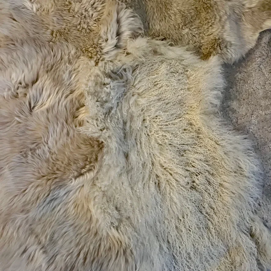 Punda by Wol Society, a dove grey and ivory sheep skin rug with soft, fluffy fleece