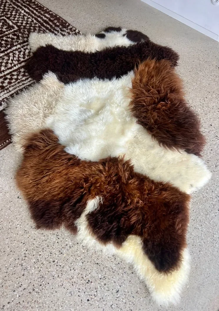 Mary by Wol Society, a brown and cream sheep skin rug with bands of cream between chocolate and russet fleece