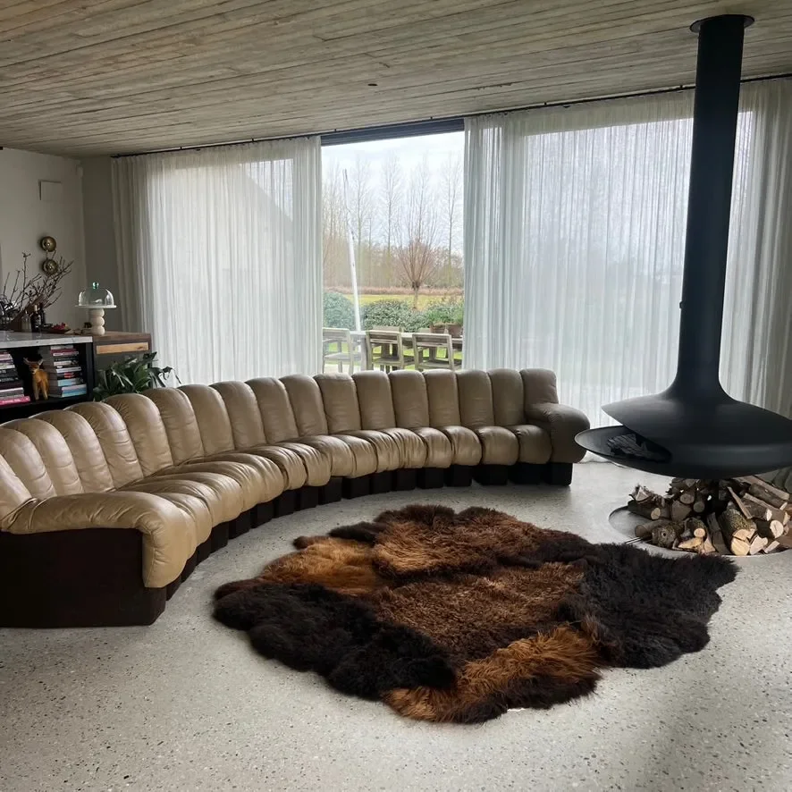 Tosca by Wol Society, a brown sheepskin rug with shaggy espresso and chestnut pelts