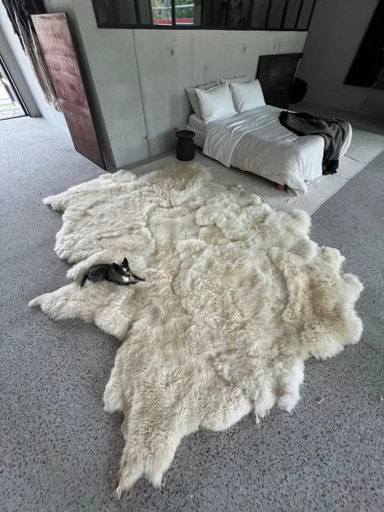 Mieke 205 by Wol Society, a cream sheep skin rug with long, wavy fleece