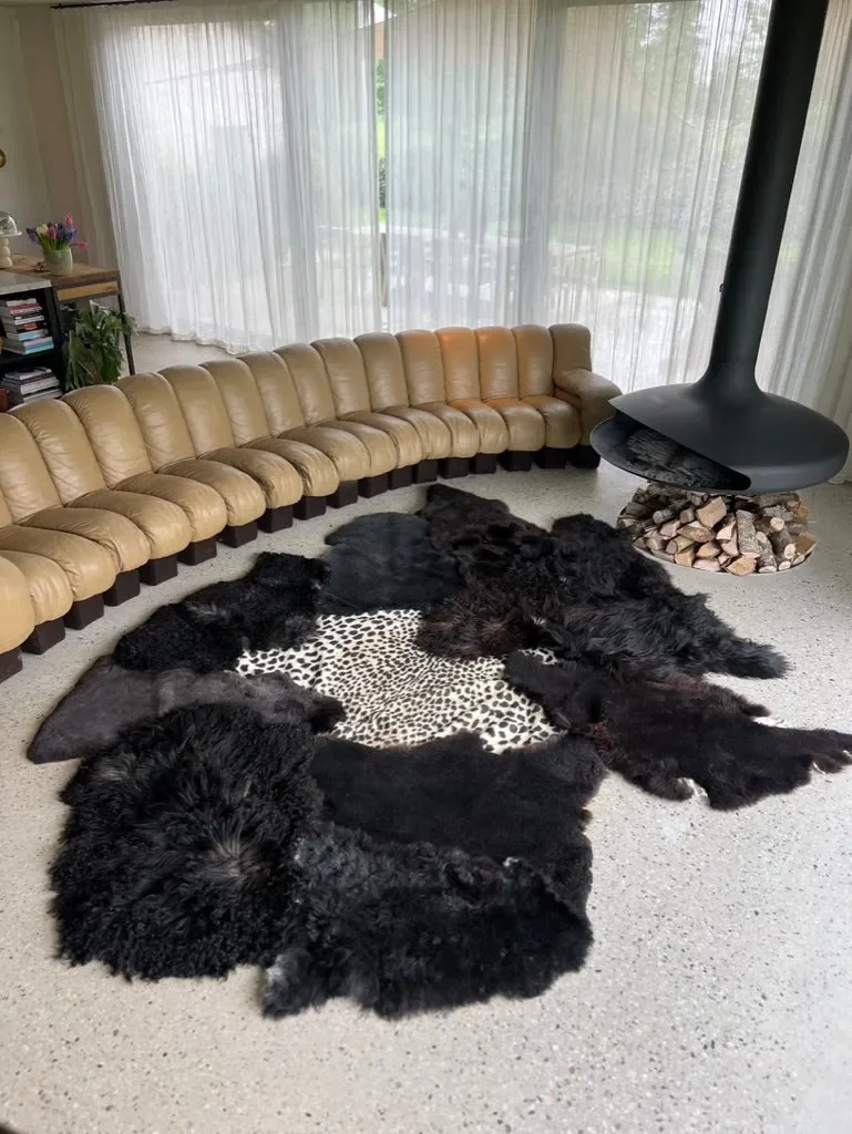 Leo by Wol Society, a giant black sheepskin rug with a faux leopard print center