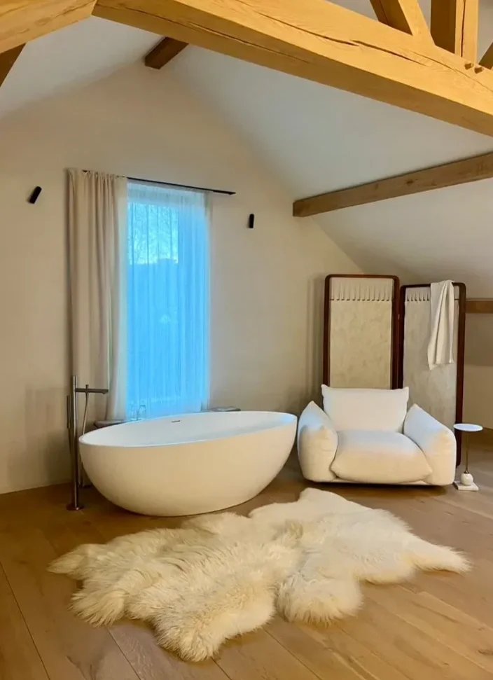 Layla by Wol Society, a creamy white sheepskin rug with long, flowing fleece
