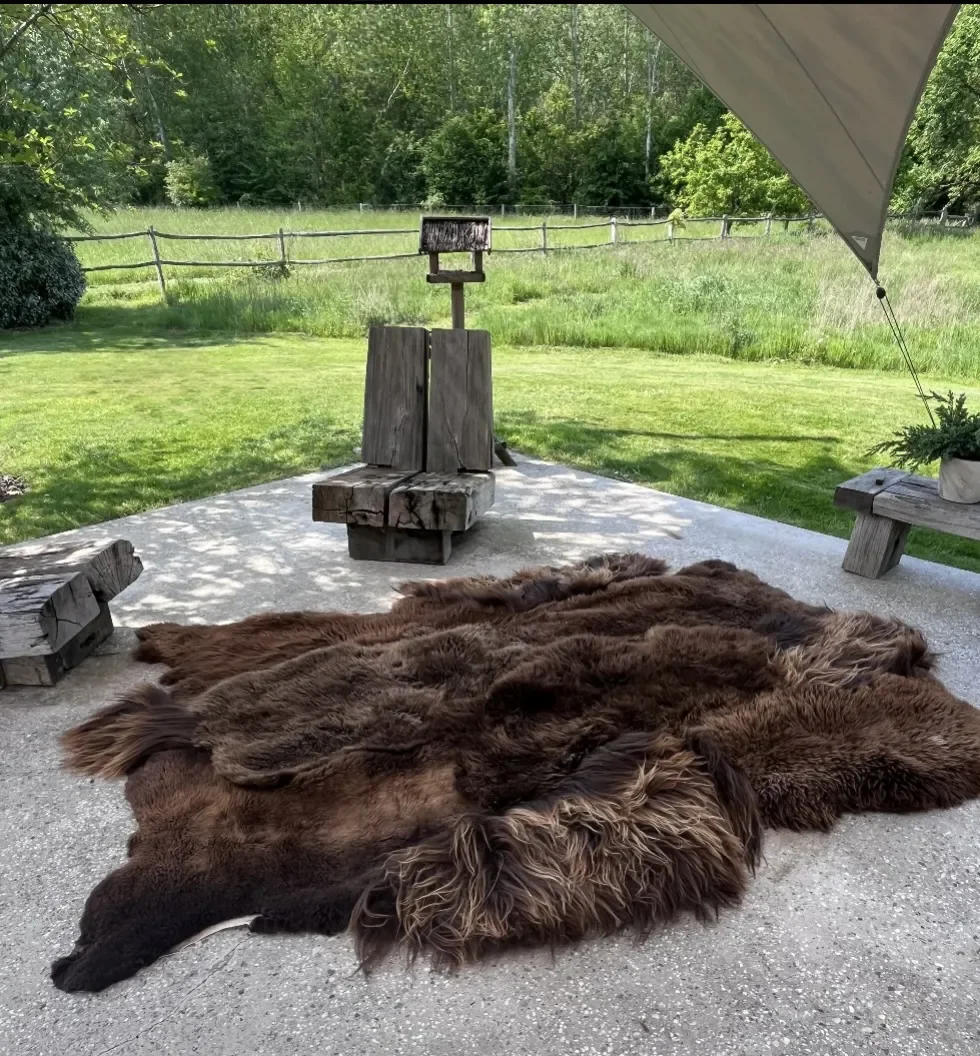 Barry by Wol Society, a shaggy dark brown sheepskin rug with caramel-colored tips