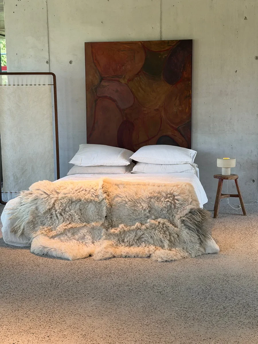 Crumble by Wol Society, a curly ivory and oatmeal sheep skin rug with a shaggy grey tuft