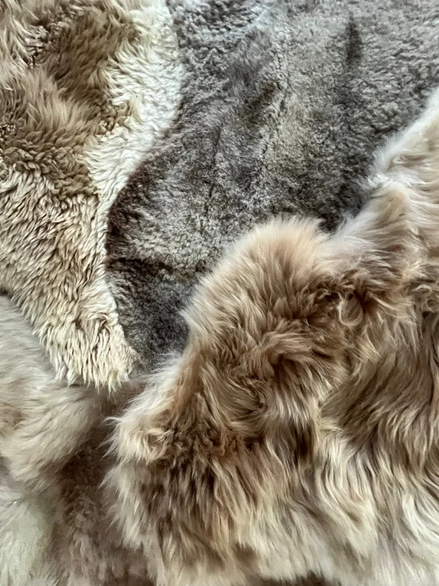 Mieke 202 by Wol Society, a taupe and silvery grey Shetland lambskin carpet.
