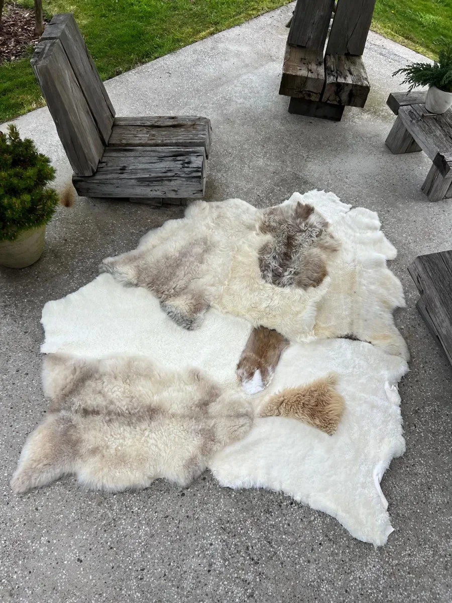 Twinkle by Wol Society, a white sheepskin rug with smooth panels and fluffy cream and taupe pelts
