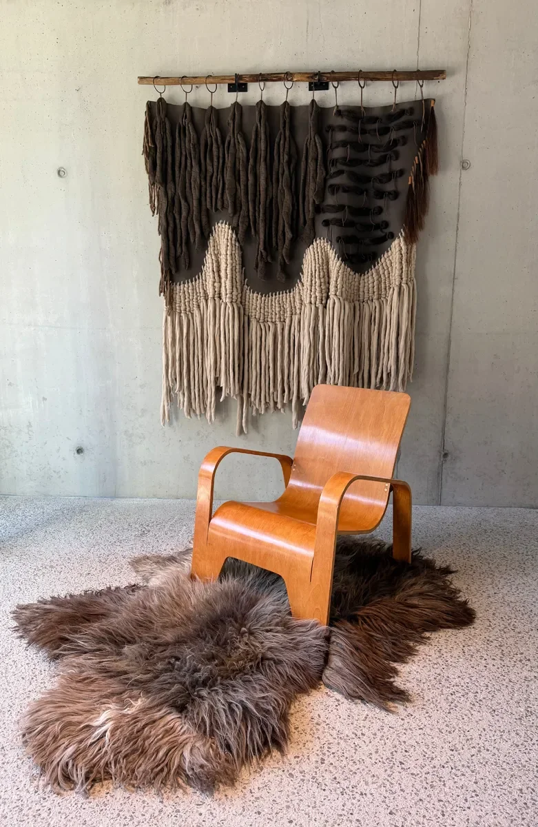 Moonstone by Wol Society, a shaggy smoky brown and grey sheepskin rug with frosted tips