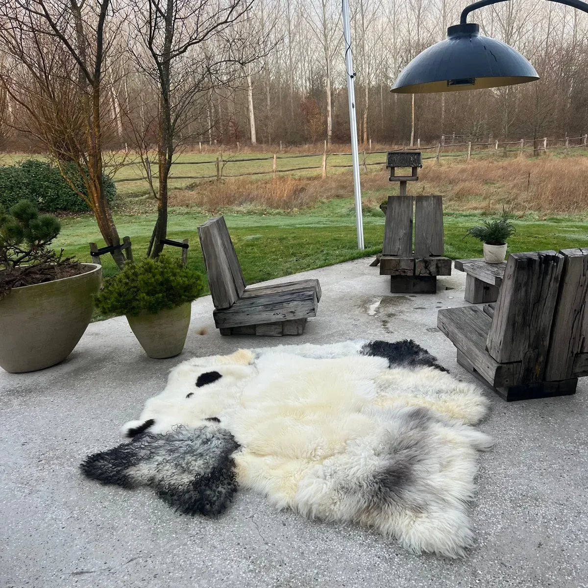 Timmy by Wol Society, a cream sheep skin rug with charcoal and soft grey pelts