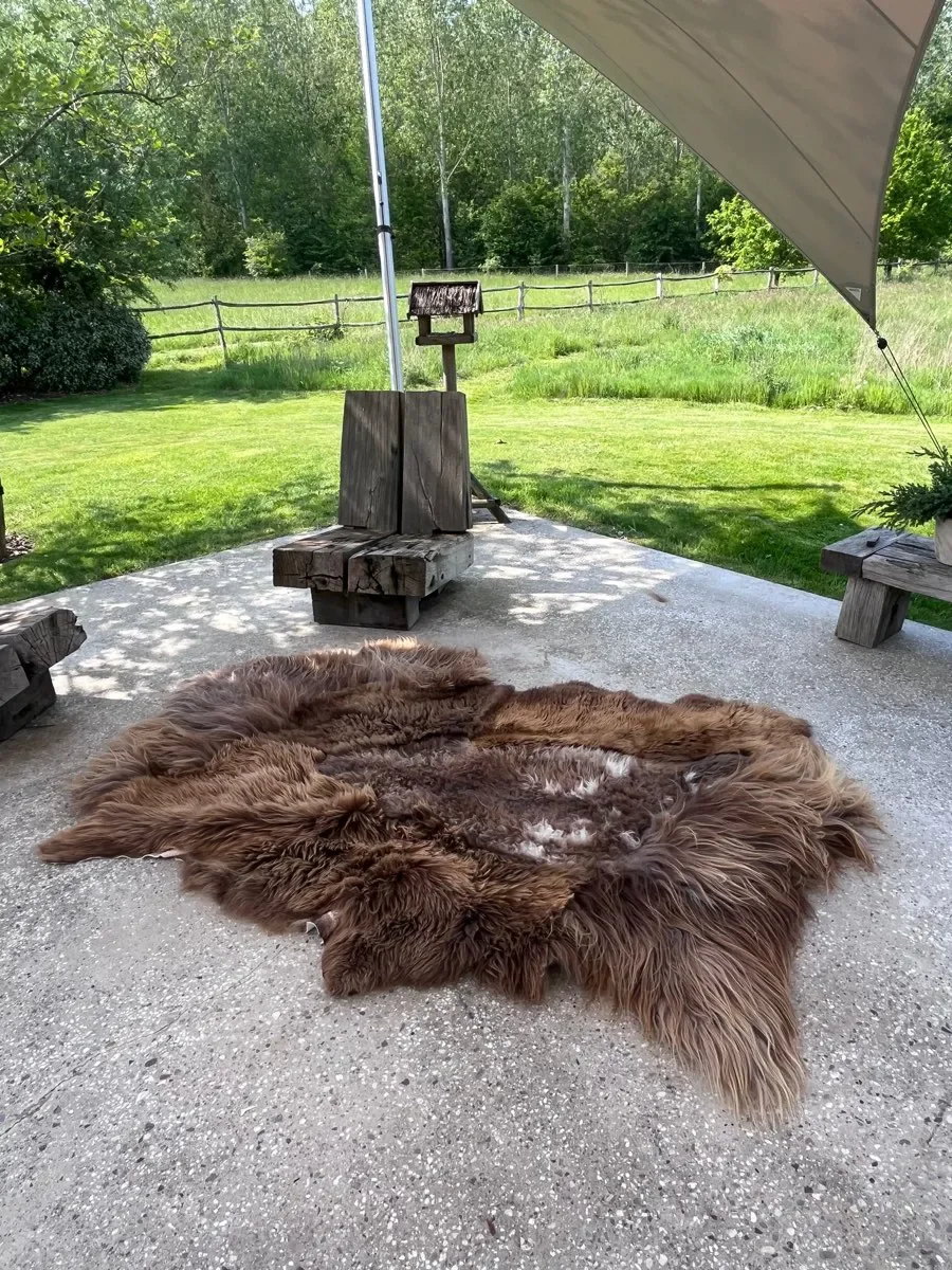 Baa-rista by Wol Society, a shaggy coffee-brown sheep skin rug with toffee tips and cream flecks.