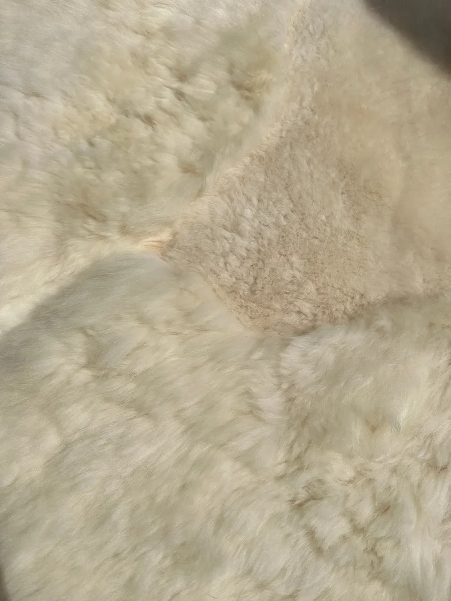 Mieke 195 by Wol Society, a giant creamy ivory sheep skin rug with plush, fluffy fleece