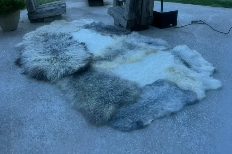 Suus by Wol Society, a large grey sheepskin rug in silver, charcoal and ivory