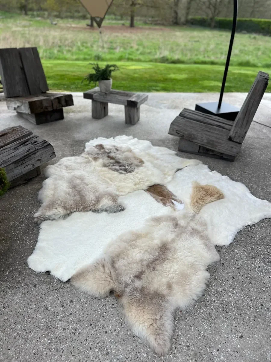 Twinkle by Wol Society, a white sheepskin rug with smooth panels and fluffy cream and taupe pelts