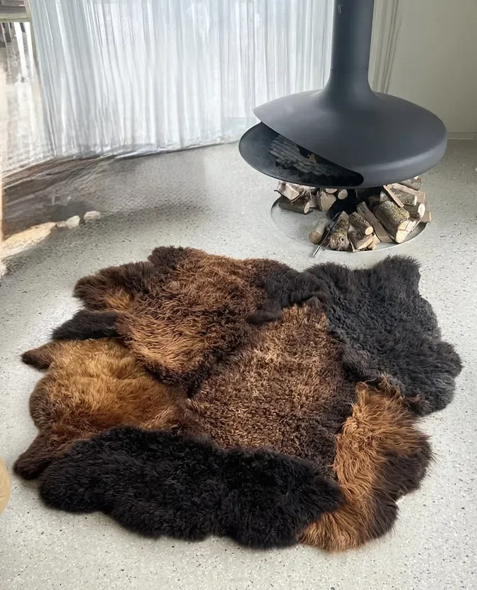 Tosca by Wol Society, a brown sheepskin rug with shaggy espresso and chestnut pelts