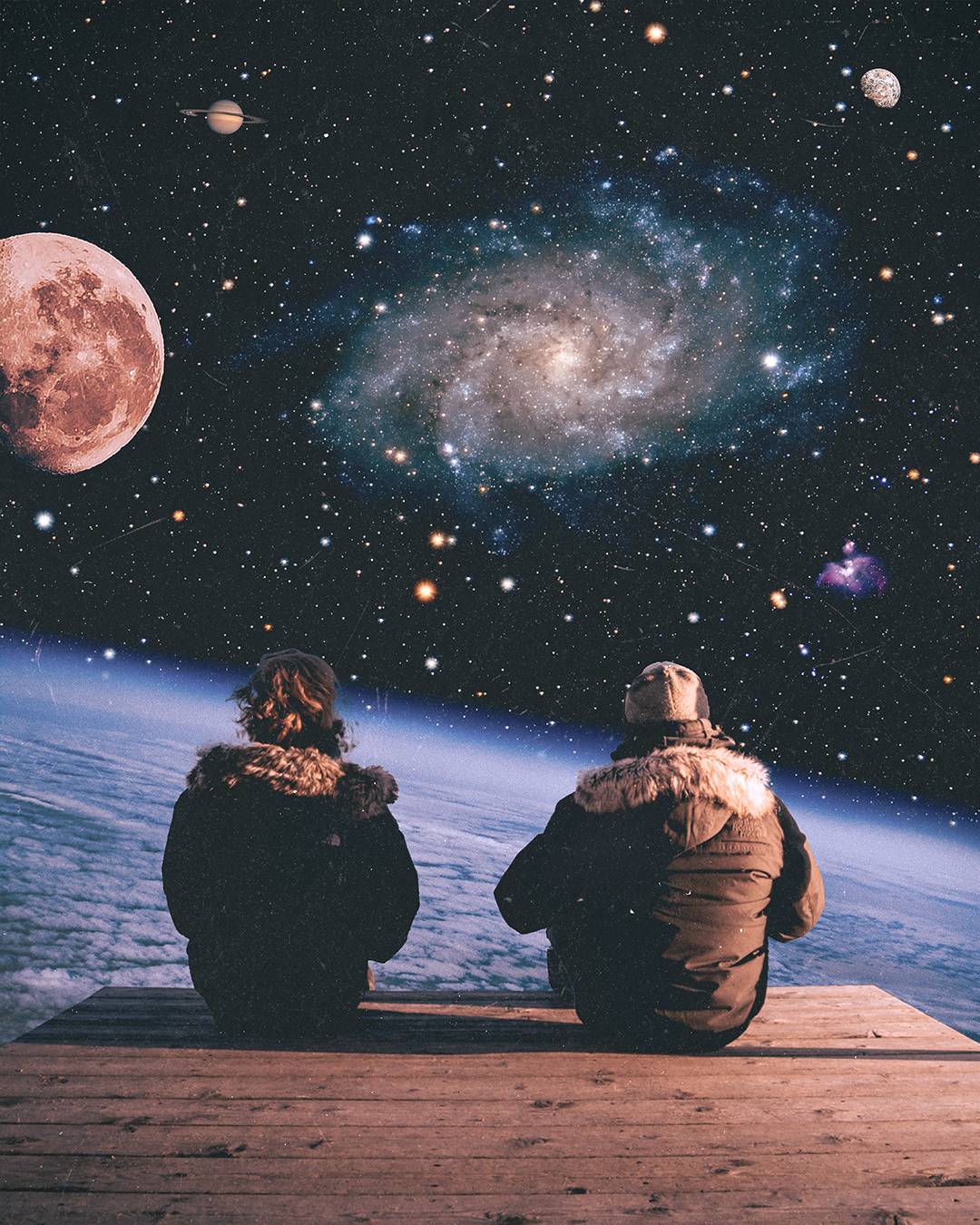 Two people sitting on a wooden platform looking at a starry sky with moons, planets, and the galaxy.