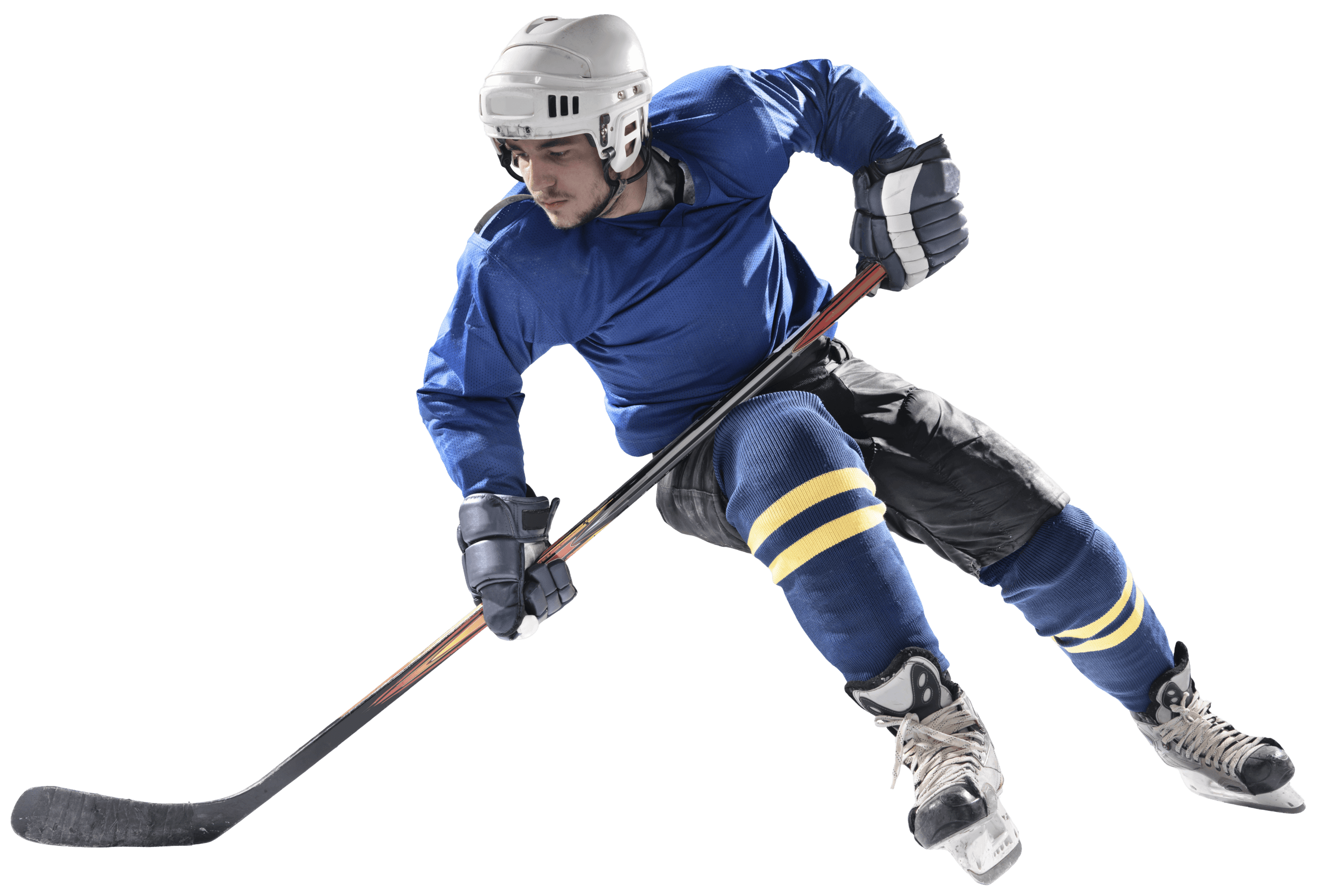 Ice hockey player in a blue jersey skating with a hockey stick gliding the stick back and then quickly forward to make the shot slamming the puck into the goal mesh.
