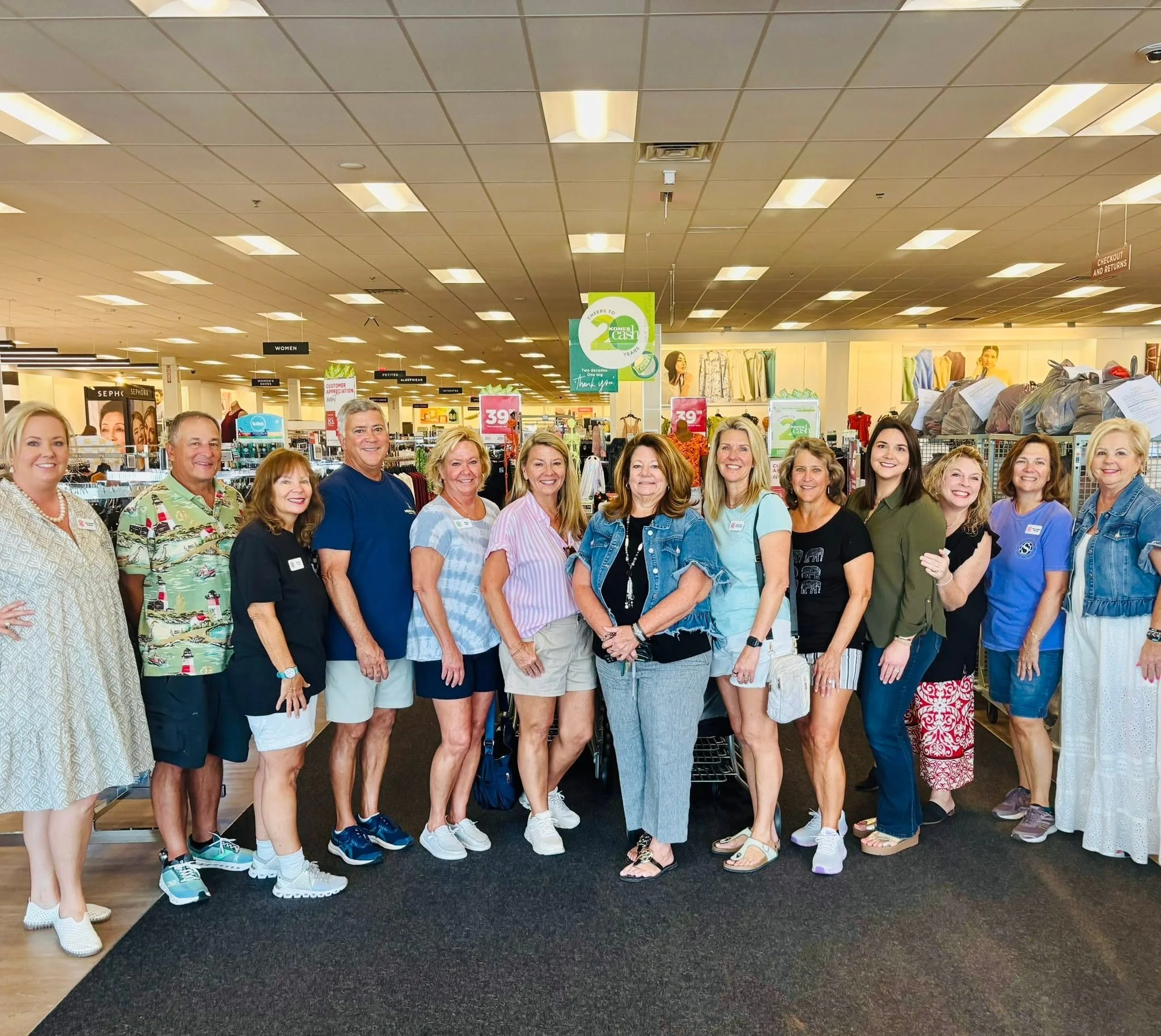 Group of Junior Service League volunteers posing together inside Kohls for the Kids Shopping trip supporting Port St Joe and Wewahitchka elementary kids