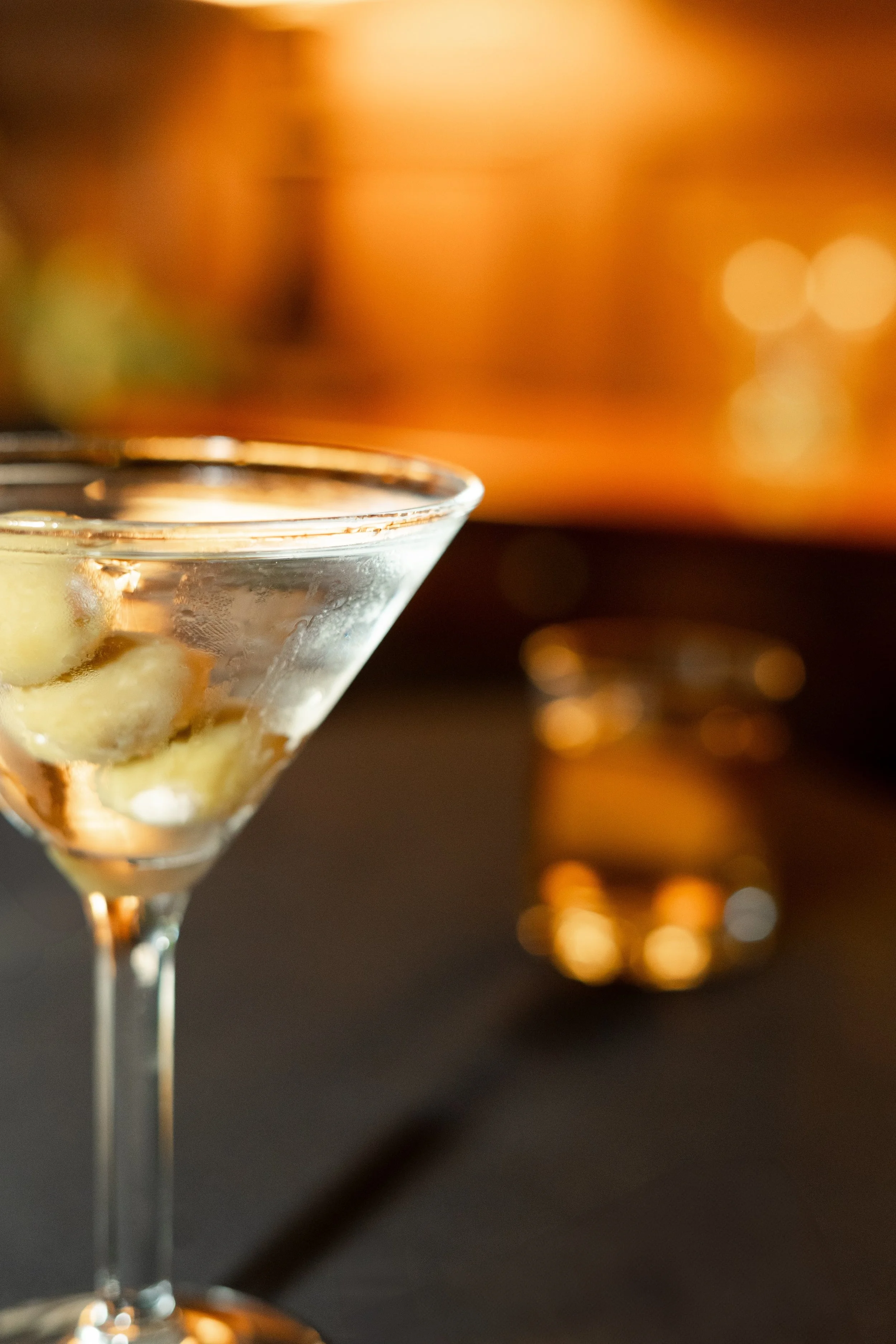 Close up of a dirty martini with olives photographed during a branding session by Lillie Ruth Photography