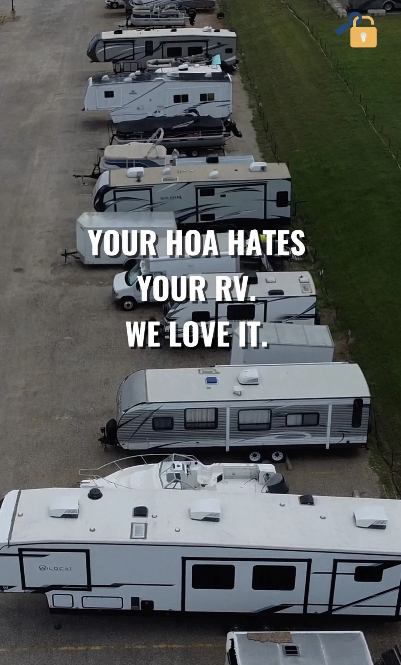 Aerial view of multiple parked recreational vehicles (RVs) and trailers on a gravel lot with grass on the side, accompanied by white text in the center that reads, "Your HOA hates your RV. We love it."