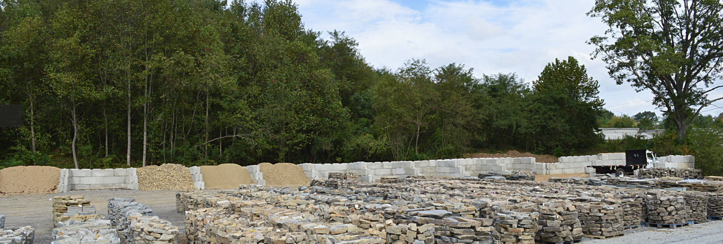 French Broad Yard with a large selection of natural stone