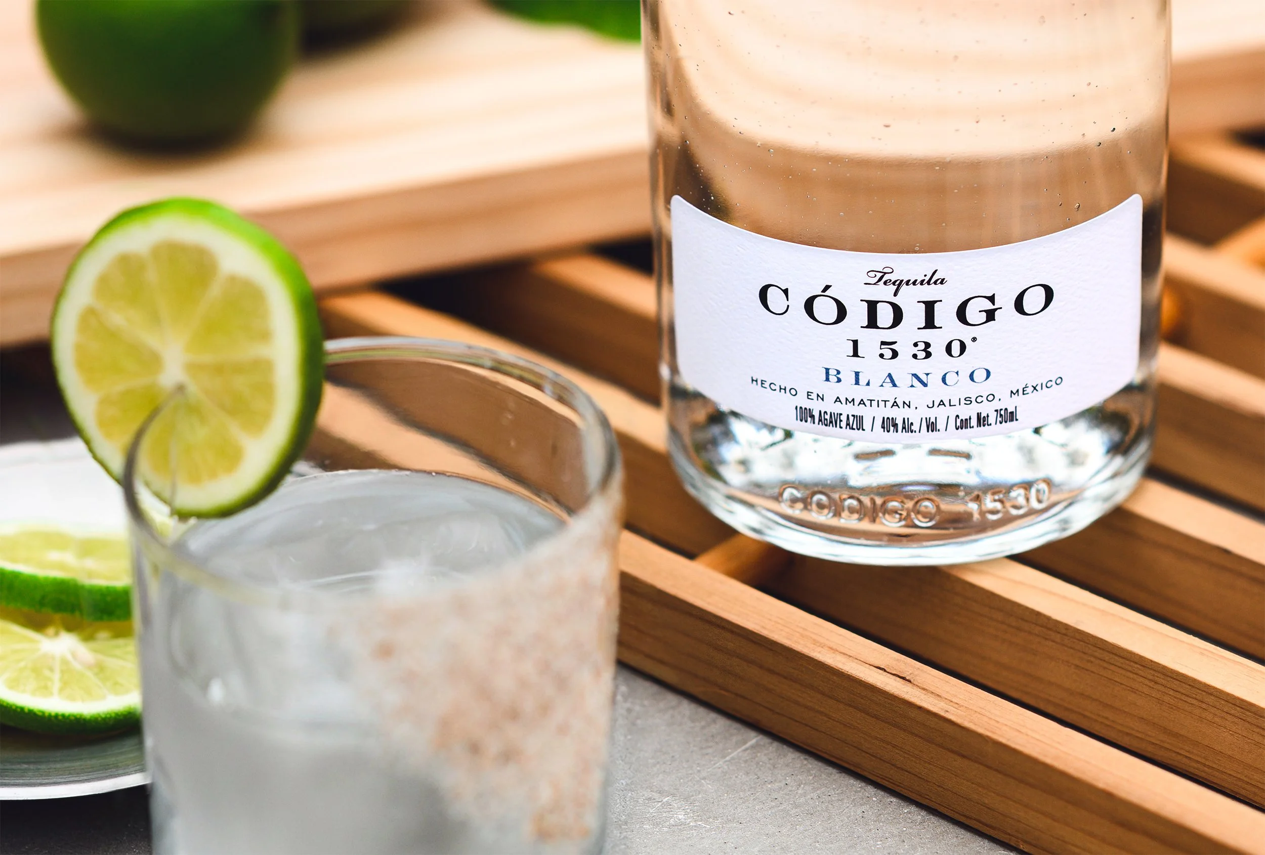 lifestyle photo of margarita and codigo tequila bottle