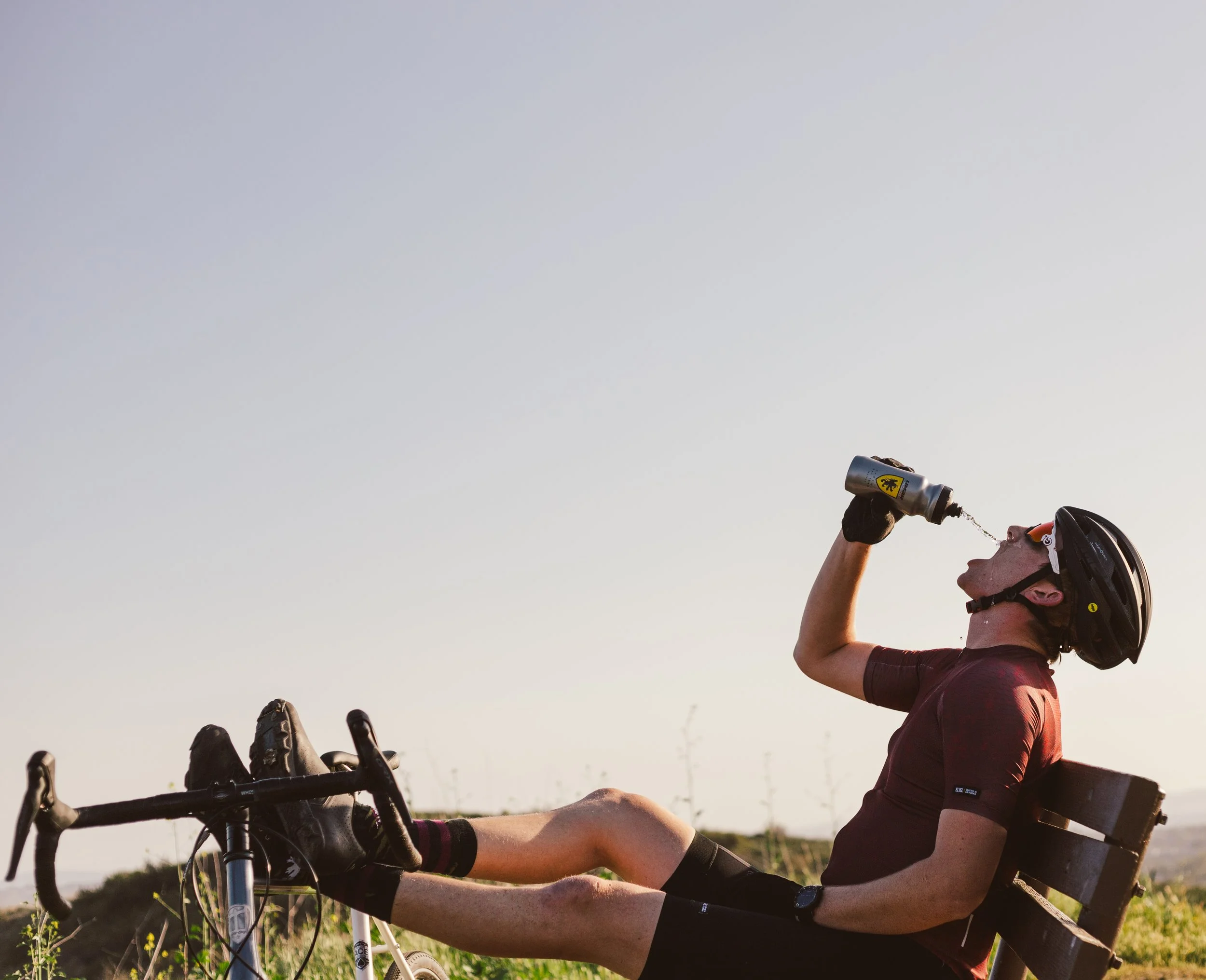 lifestyle photo of rider squirting water bottle