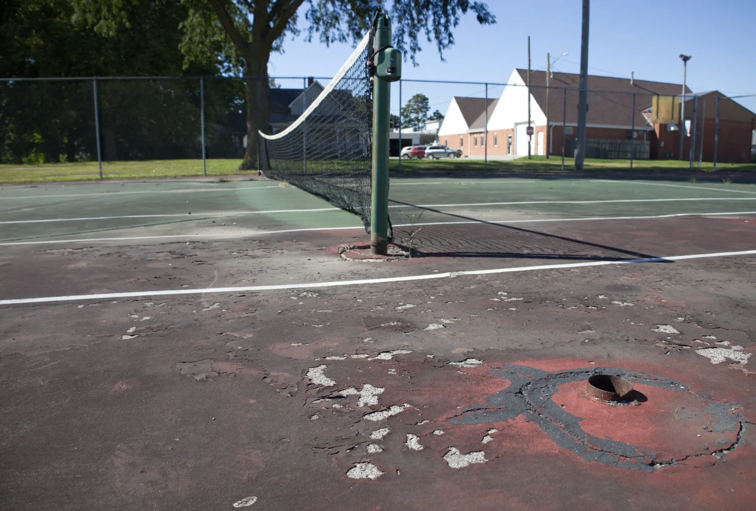 Rough patchy area on a tennis court