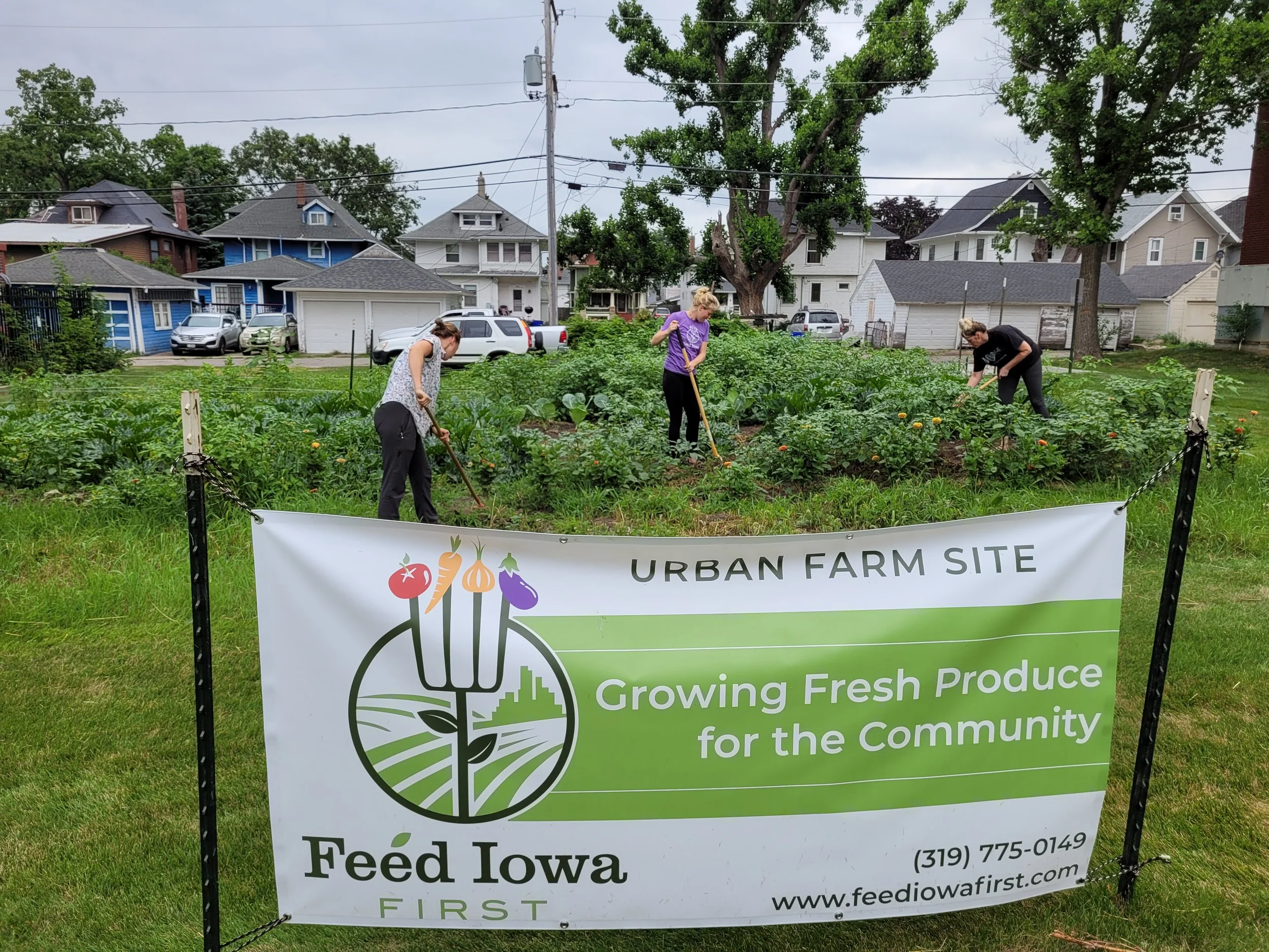 Feed Iowa First banner in front of people gardening