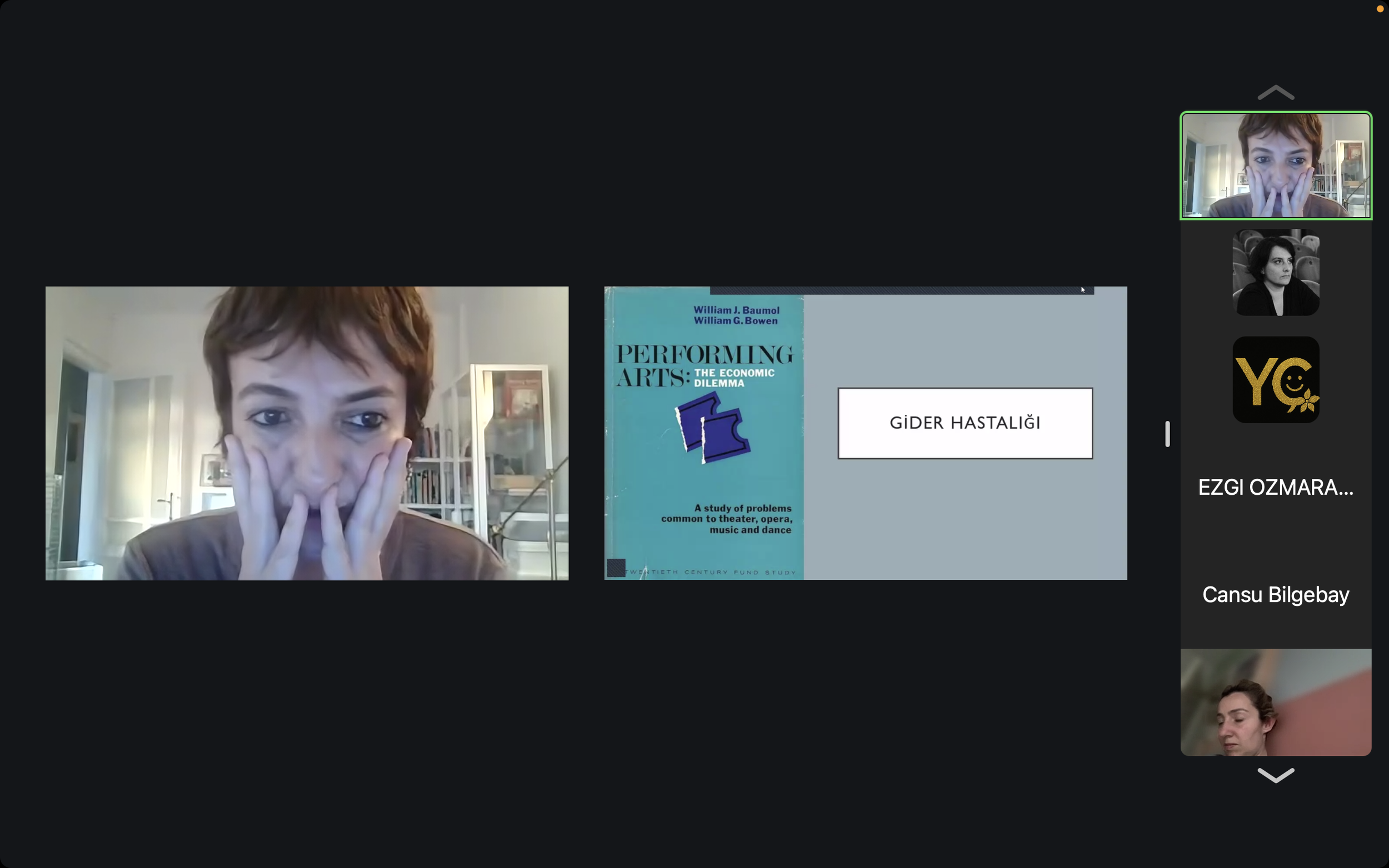 A woman with short brown hair and a brown shirt covers her face with her hands during a video call. There is a slide presentation on the screen titled 'Performing Arts: The Economic Dilemma' by William J. Baumol and William G. Bowen, discussing probl