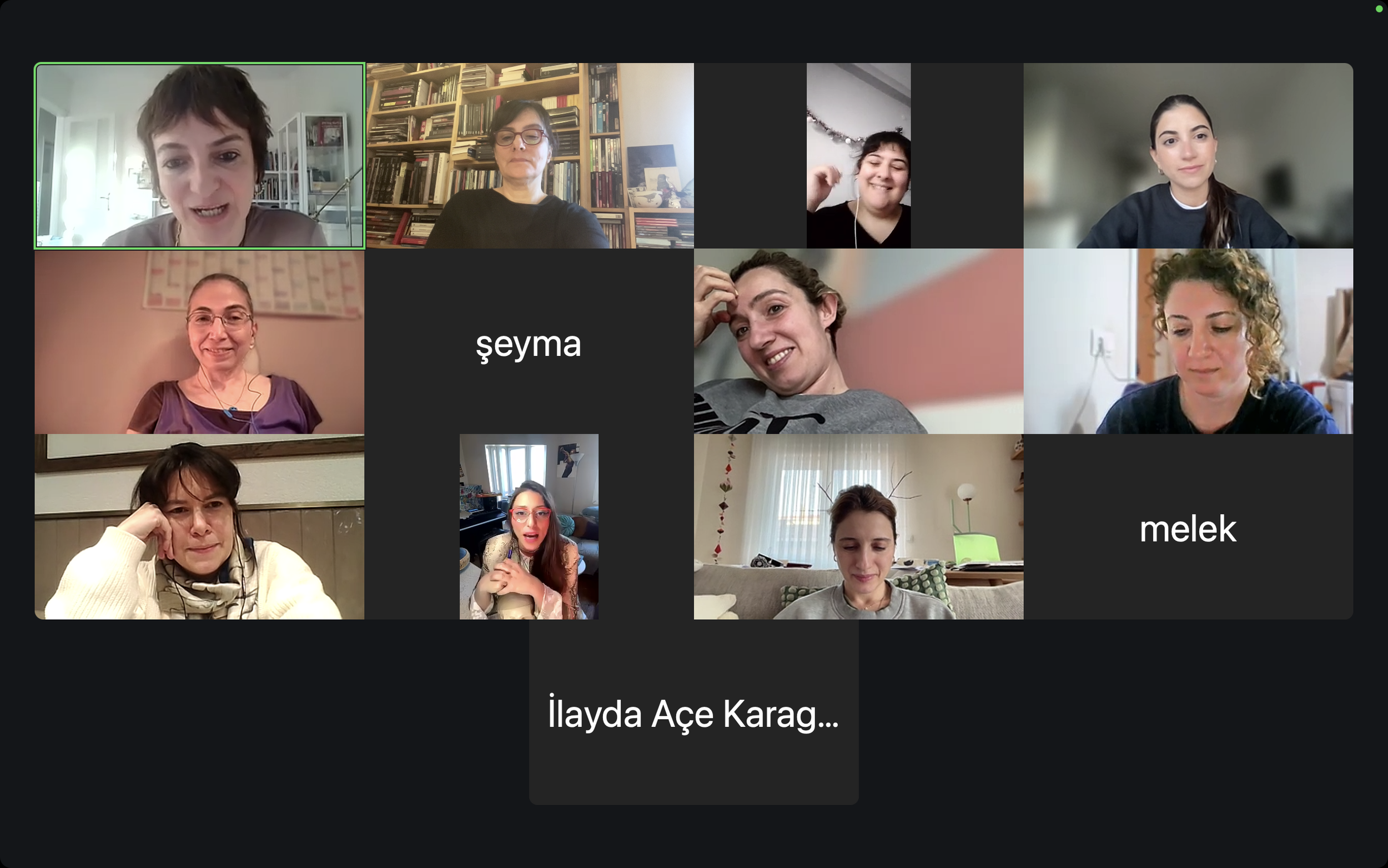 Screenshot of a virtual meeting with several women participating from home, some wearing headphones, in a grid format.