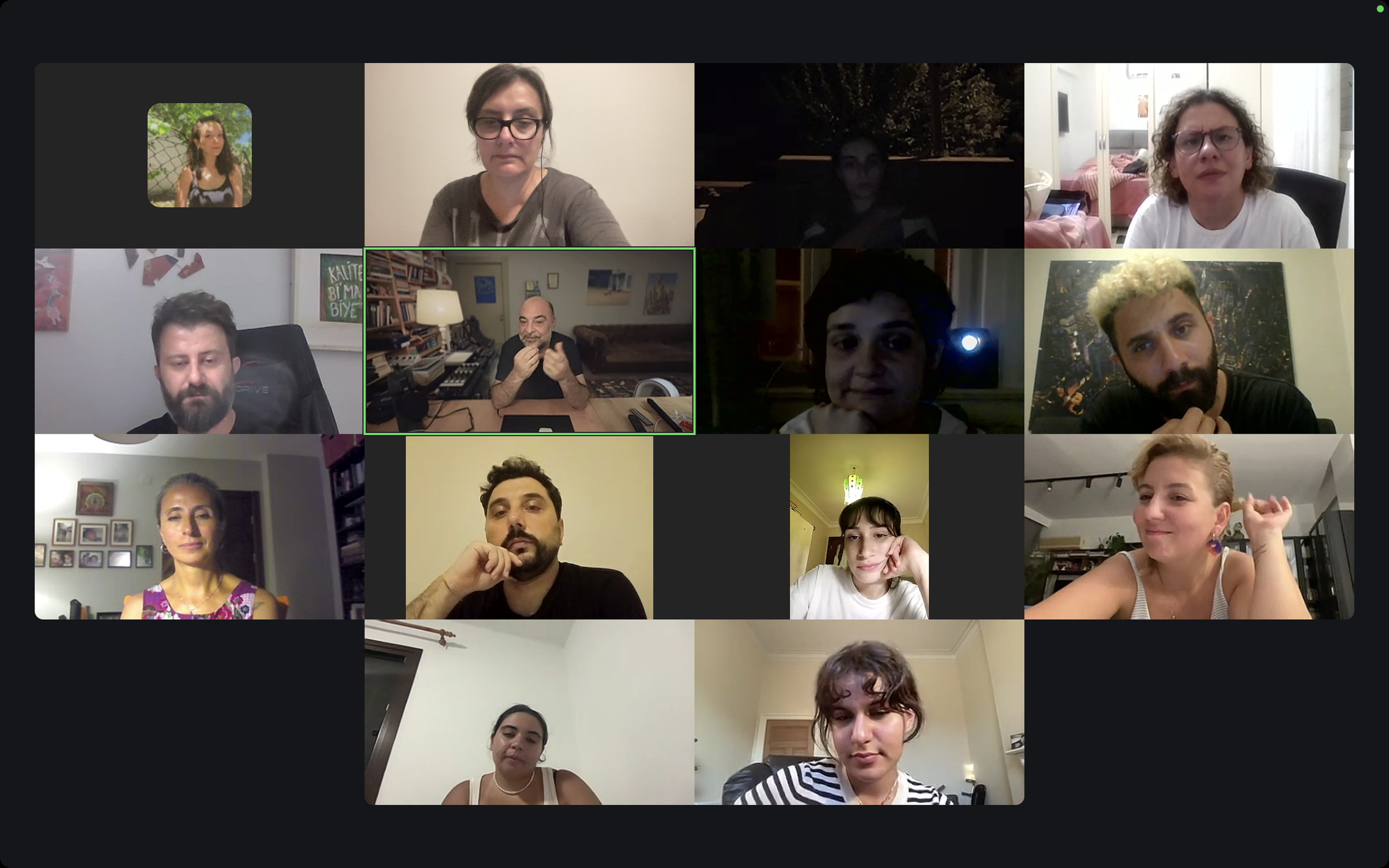Screenshot of a virtual meeting with multiple people in individual video tiles, some with expressions of focus or thought.