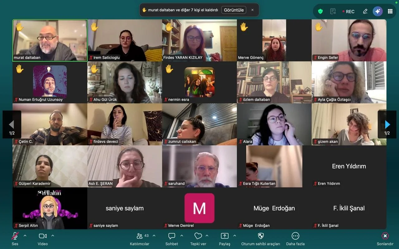 Screenshot of a virtual meeting with multiple participants in a grid view, some with their cameras on and others with avatars or profile pictures, holding a virtual hand up.