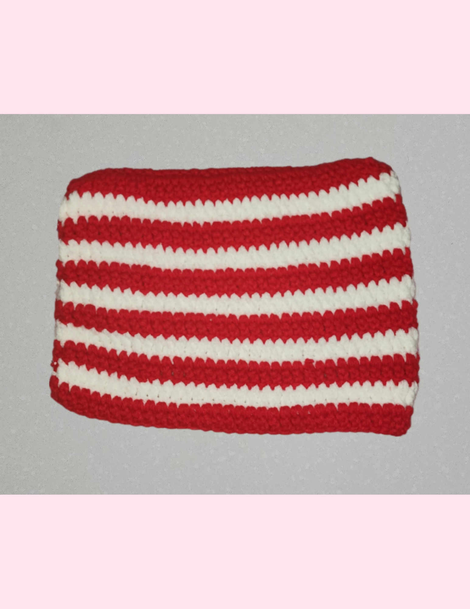 red cat beanie on counter.png