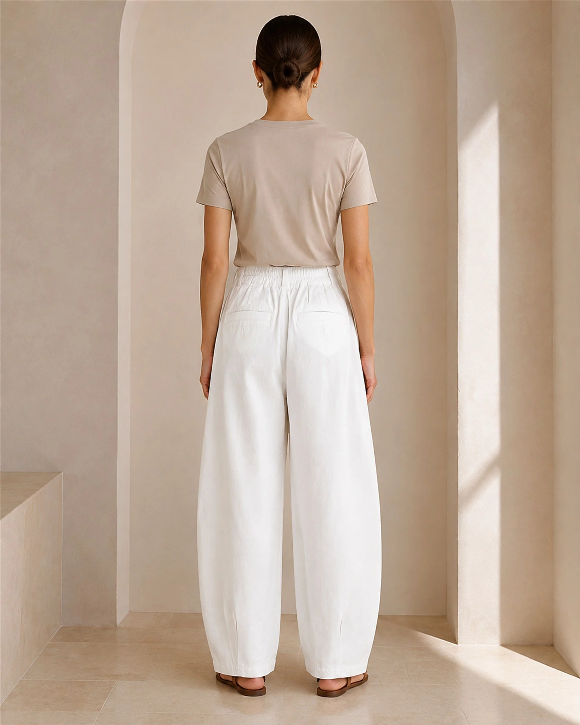 Back view of The Flax Studio white Button Front Crepe Pant, showing the rear pockets and relaxed fit.