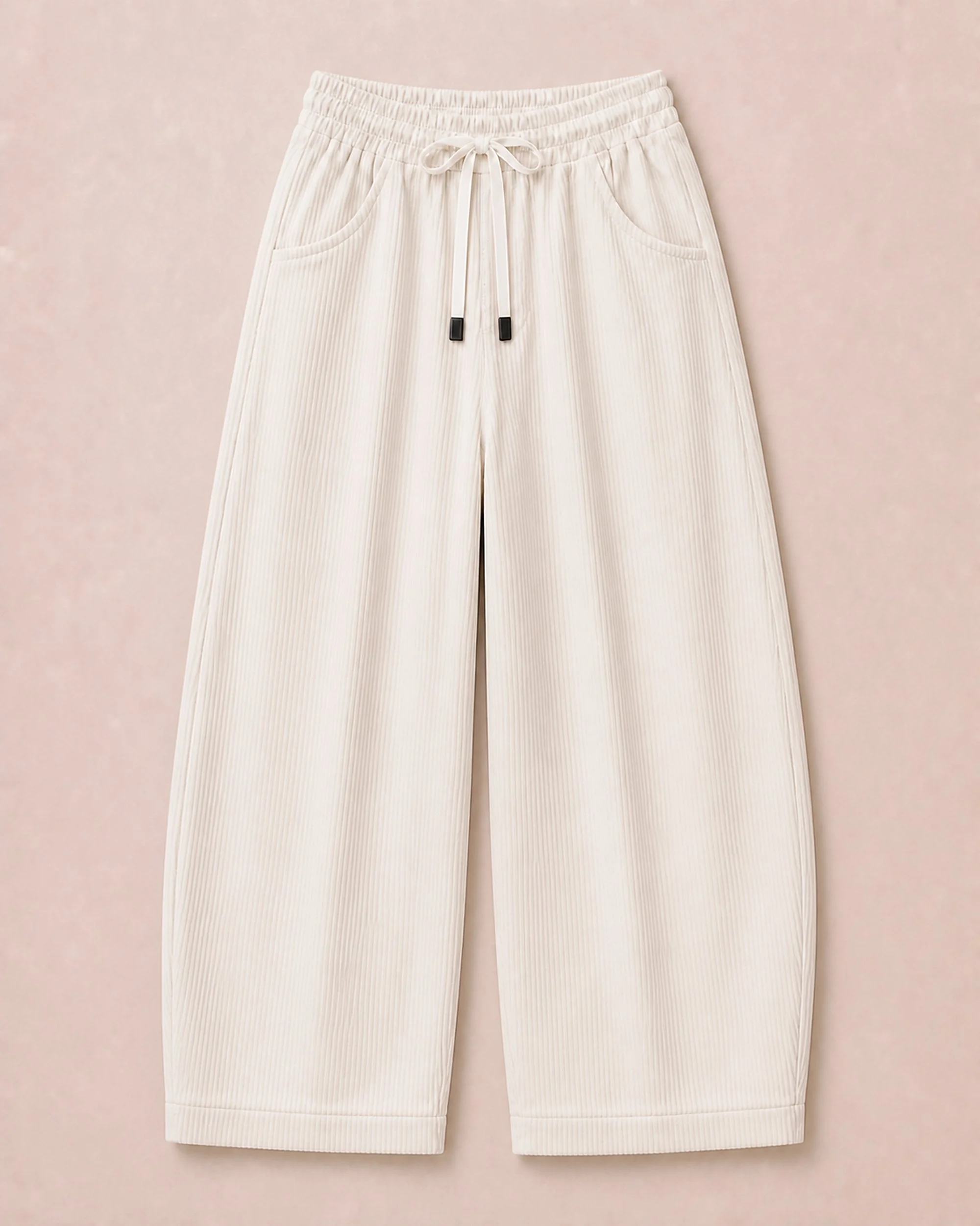 Close-up of The Flax Studio ivory Corduroy Form Pant, showing the corduroy texture and flat woven drawcord.